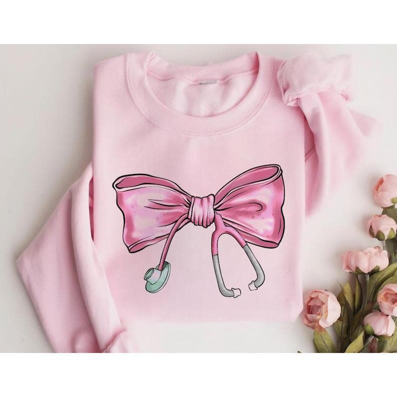Coquette Nurse Stethoscope Bow Sweatshirt - Pink Bow Nurse Gift – image 1, Nurse Tee, Nurse Merch, Nurse Shirt, Nurse Sweatshirt, Nurse Hoodie, Nurse Clothes